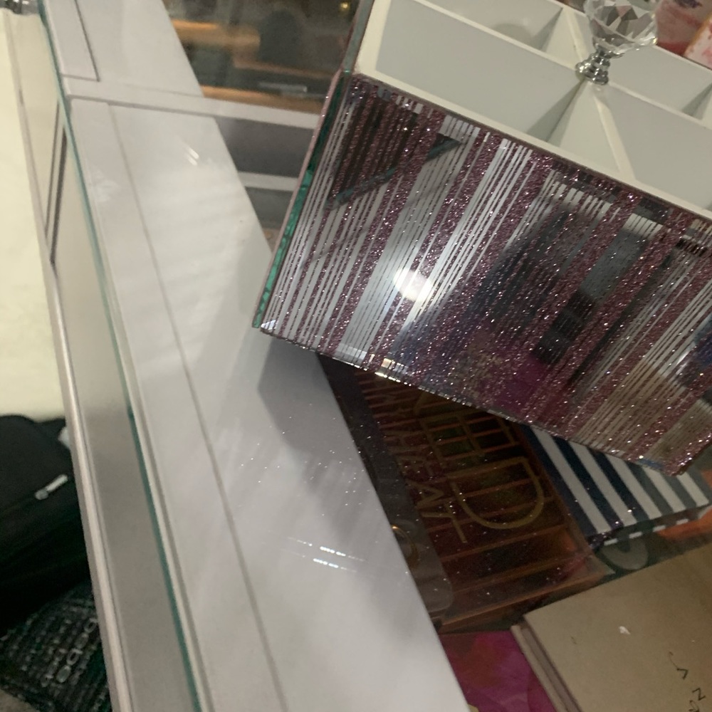 Pink sparkly rotating cube container.